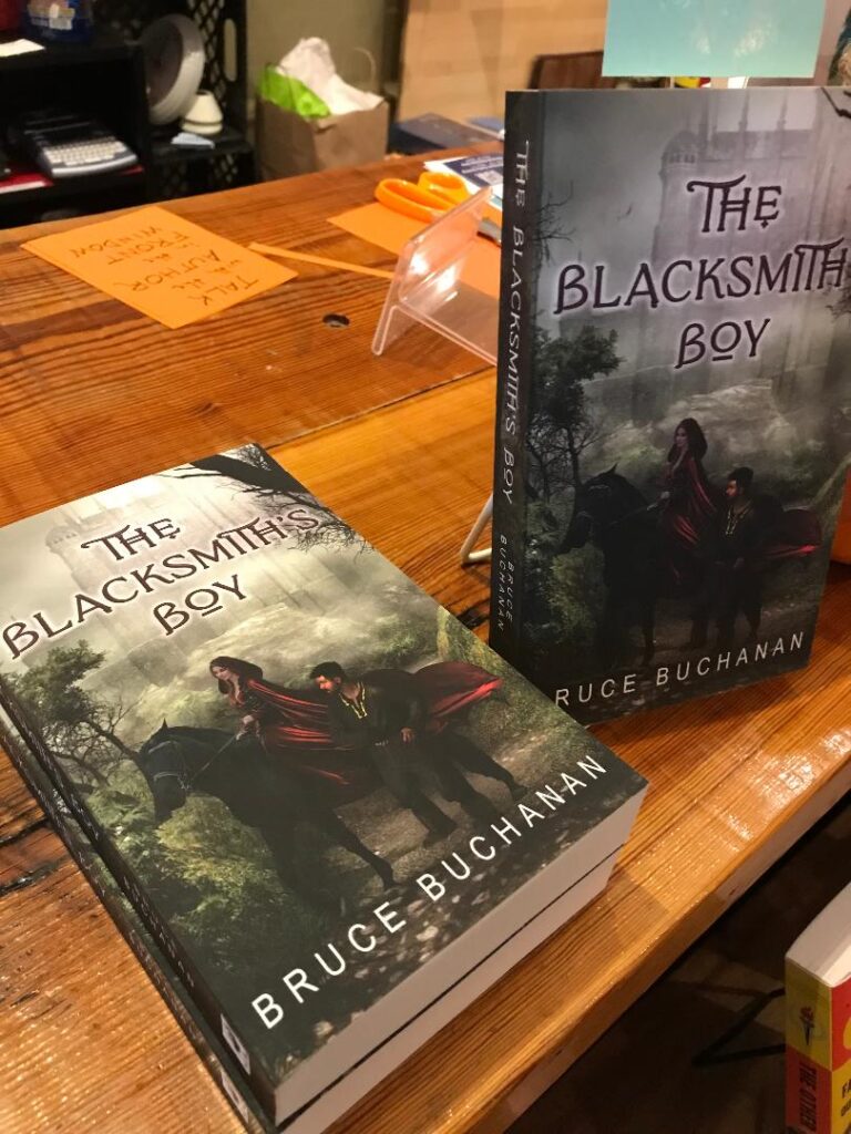 Copies of The Blacksmith's Boy novel on the counter at Scuppernong Books in downtown Greensboro